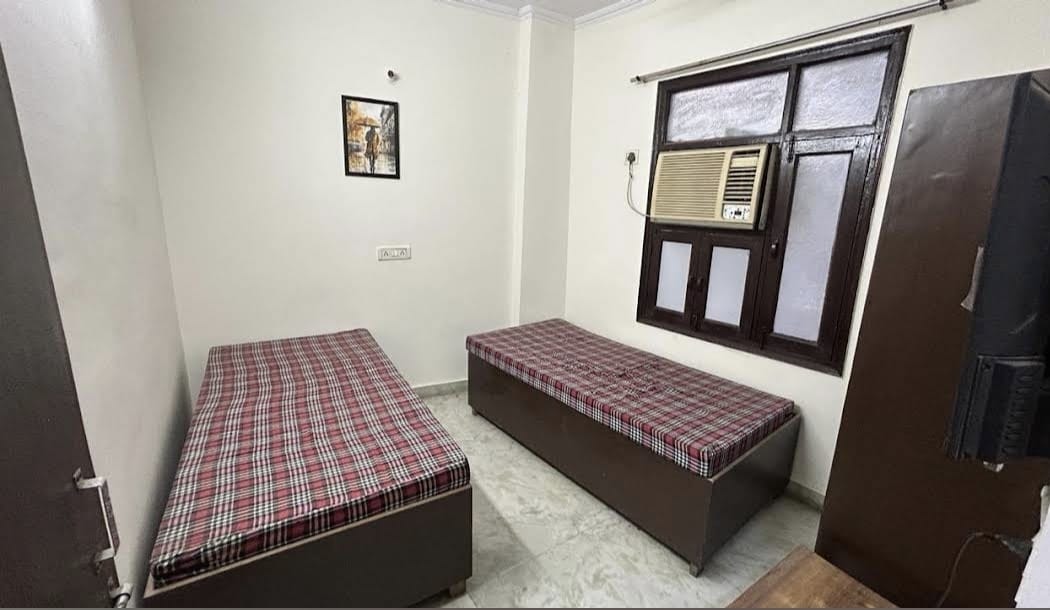 Twin sharing room with AC and study wall