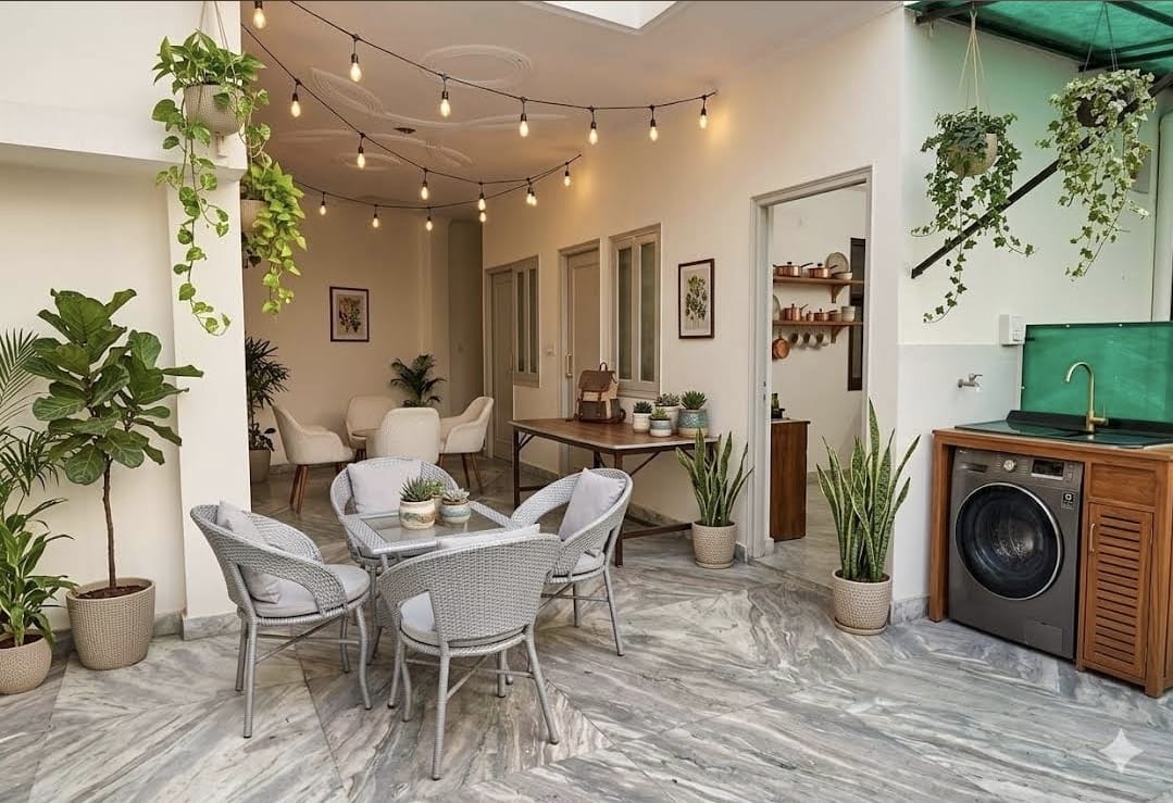 Terrace lounge with plants, seating and washing machine